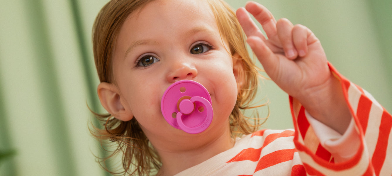 hot pink round latex pacifier from bibs